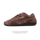 Puma Speedcat Og: This Puma Speedcat Og low-top racing shoe features a leopard p