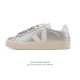 Frequently spotted in street style photos, the classic white Veja sneakers with