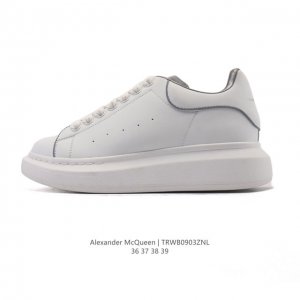 Alexander McQueen's white sneakers, featuring thick soles, height-enhancing gli