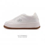 Company-level Alo Yoga Recovery Mode. Comfortable, minimalist white sneakers wit