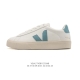 Frequently spotted in street style photos, the classic white Veja sneakers with